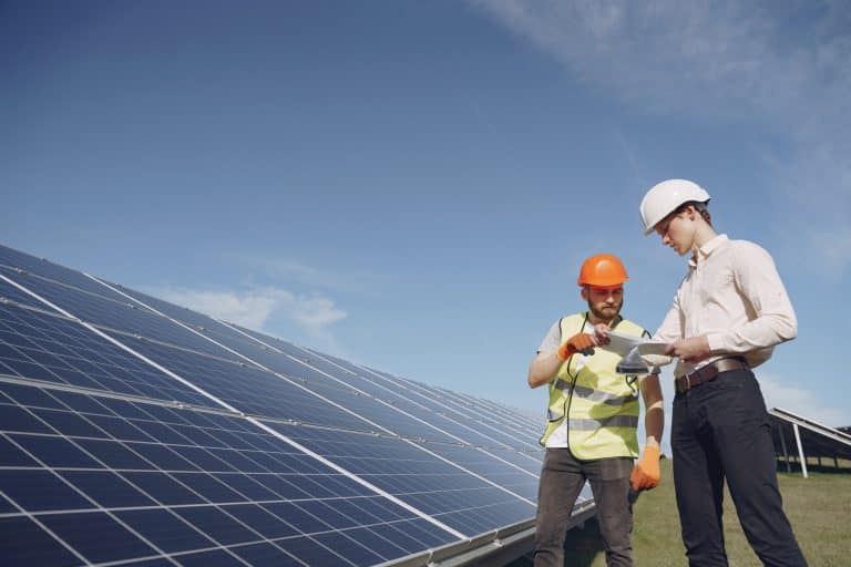 foreman and businessman at solar energy station